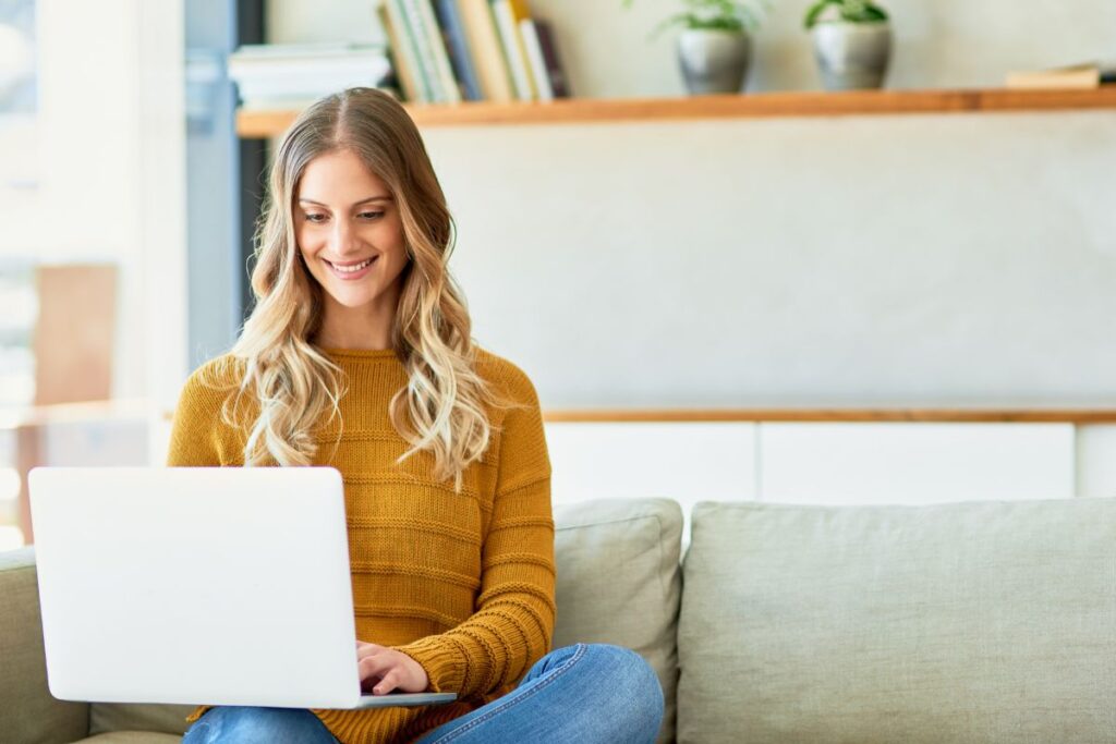 a teenage girl looking at a computer