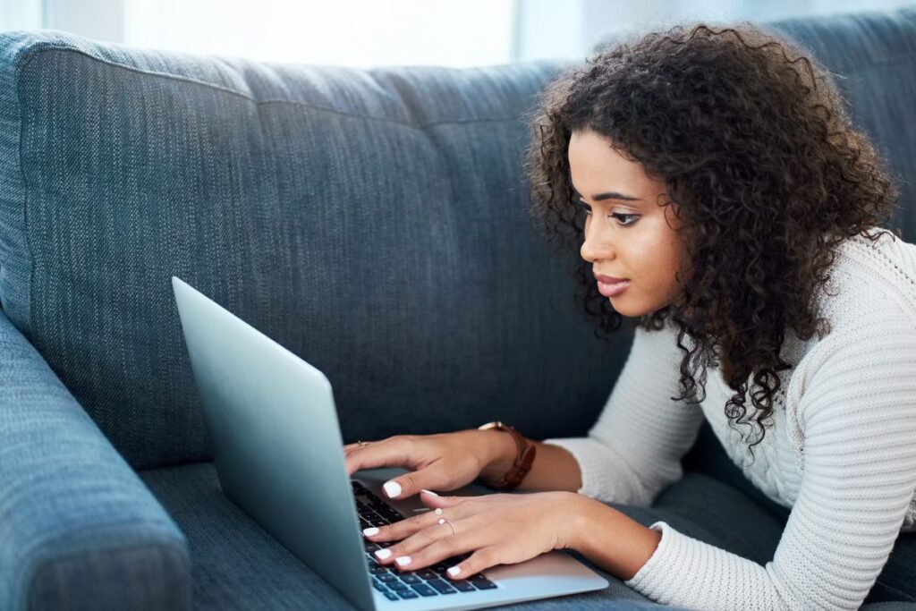 a teenage girl looking at a computer