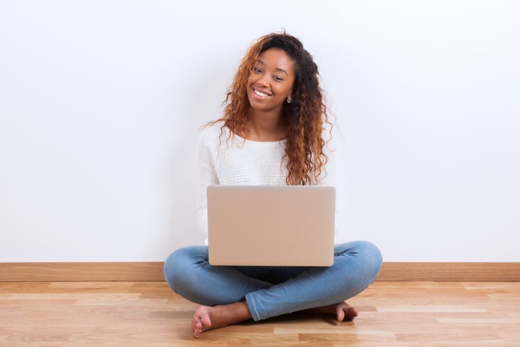 a teen girl working on a computer