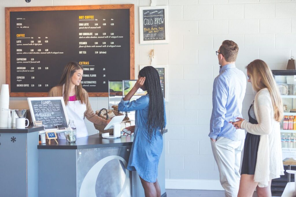 a young teen girl working at a coffee shop